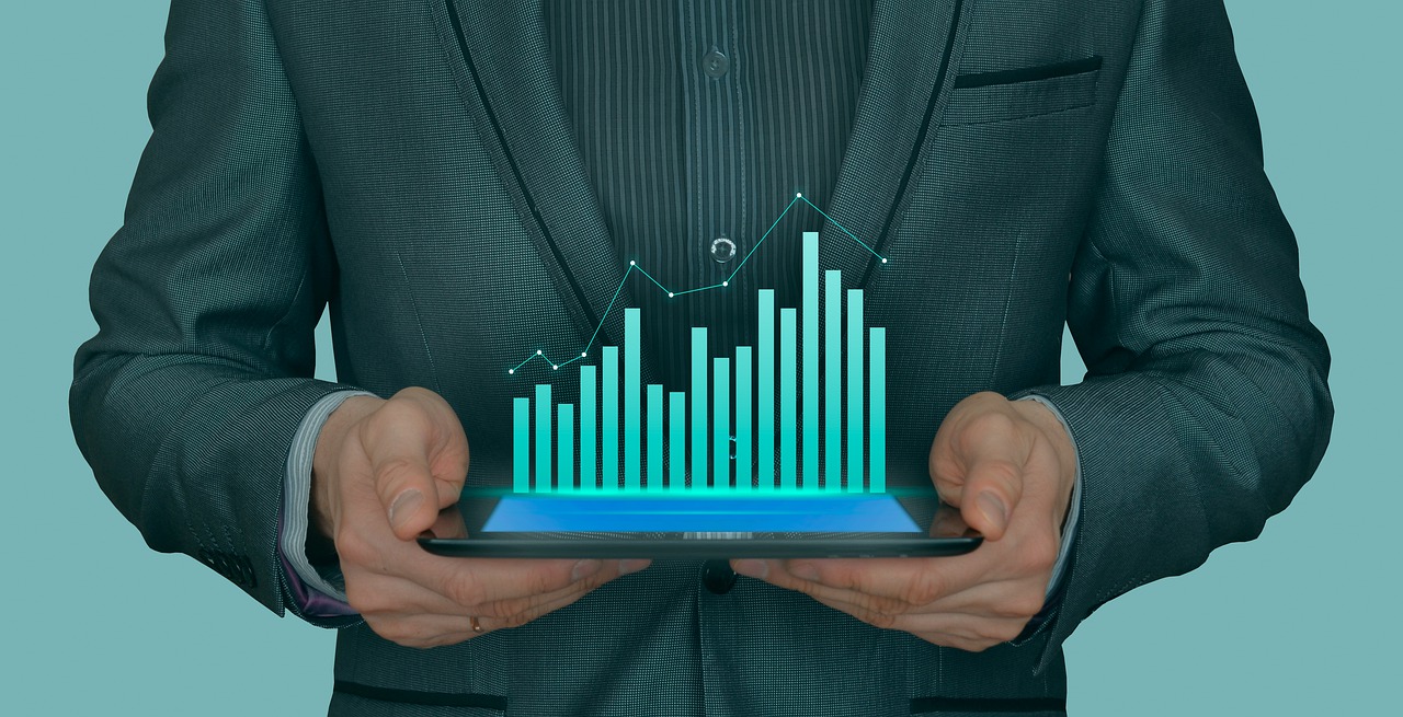 a guy in s costume presenting a chart of dance studio growth if it is being managed according to a dance studio business plana 