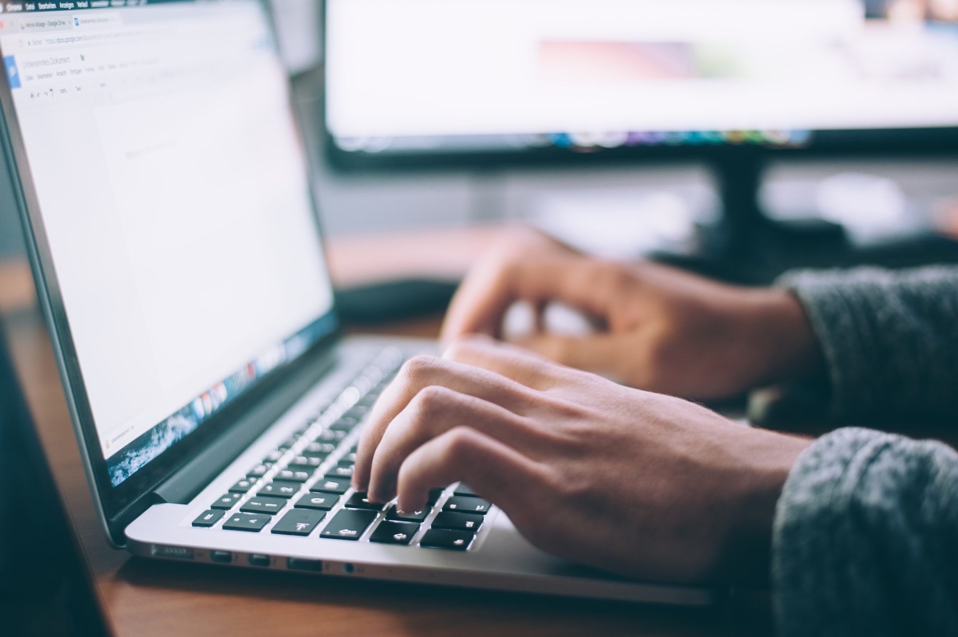 person creating dance studio registration form on the laptop