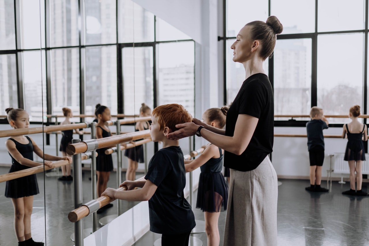 teacher at ballet dance studio after registering a student in the form