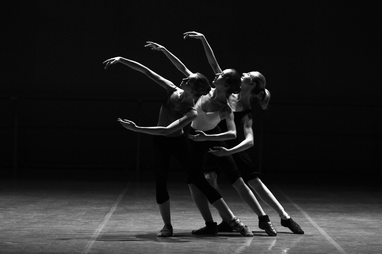 Three Female Dancers Dancing in Studio